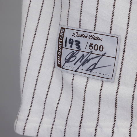 closeup of sleeve of pinstripe jersey with patch showing JB autograph and limited edition number