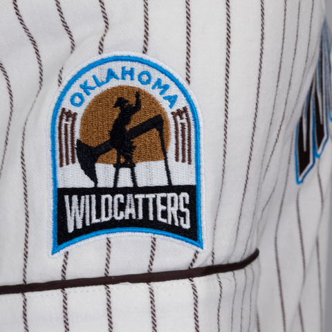 Closeup of sleeve of pinstripe jersey with OKLAHOMA WILDCATTERS logo patch